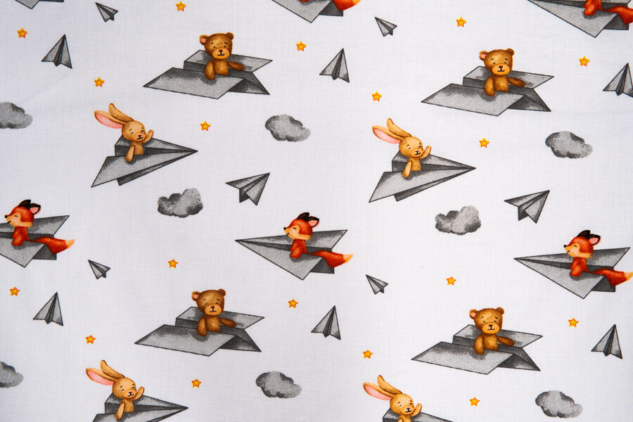 Animals in paper airplanes on a white background